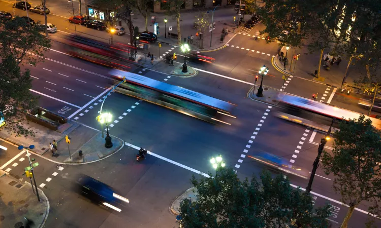 Modern urban street lighting powered by Sundrax's adaptive smart technology, enhancing sustainability and safety