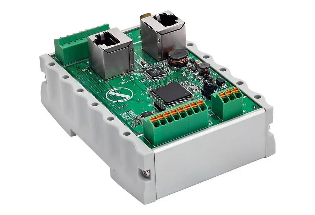 Angled perspective of PixelGate DIN with dual Ethernet ports and green SPI terminal blocks
