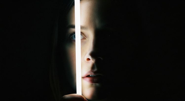 A symbolic study of light and shadow representing emotional focus, perception, and the intimate power of controlled illumination.