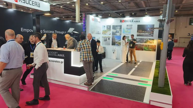 The NORATEX team engages visitors at BEYOND EXPO 2025, showcasing MONARQ Mini’s wireless control for cathedral lighting designs